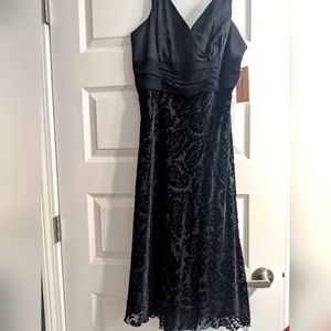 Black cocktail dress. Pretty fabric.